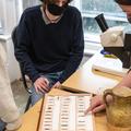 Students looking at petrographic thin sections 