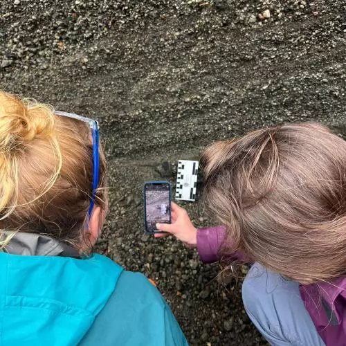 Danielle takes a close up of stratigraphy