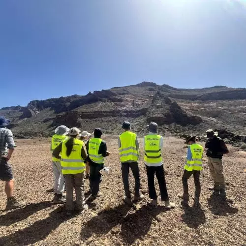 The team in the landscape looking away from the camera