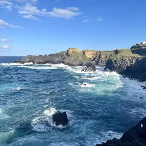 Waves crash on the coastal cliffs