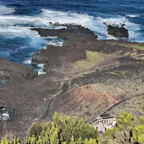 This coastal shot of blue seas and white waves