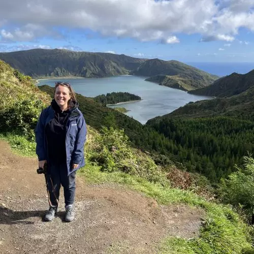 a photo of Danielle on site in front of the caldera lake
